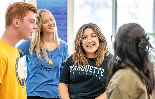 undergraduate students studying together at the library