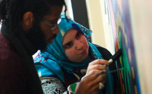 Students painting together