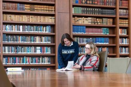 students textbook discussion at eckstein law library 