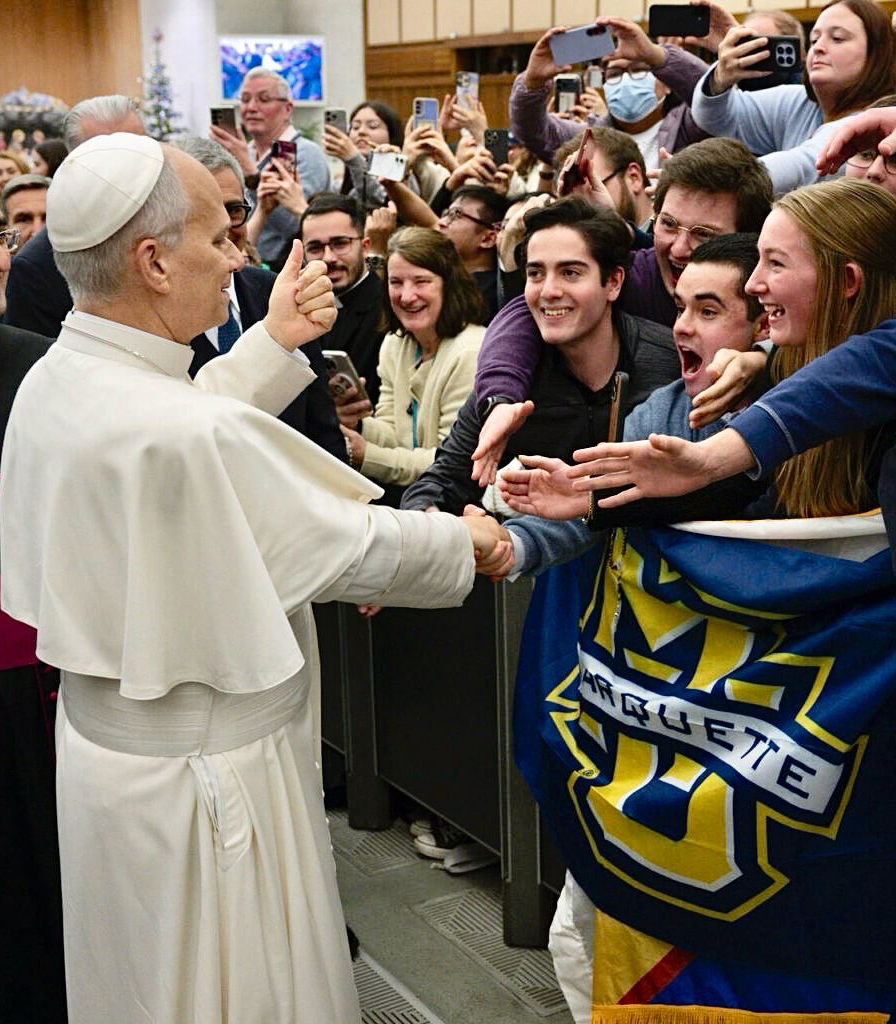 marquette student shakes hand of Pope