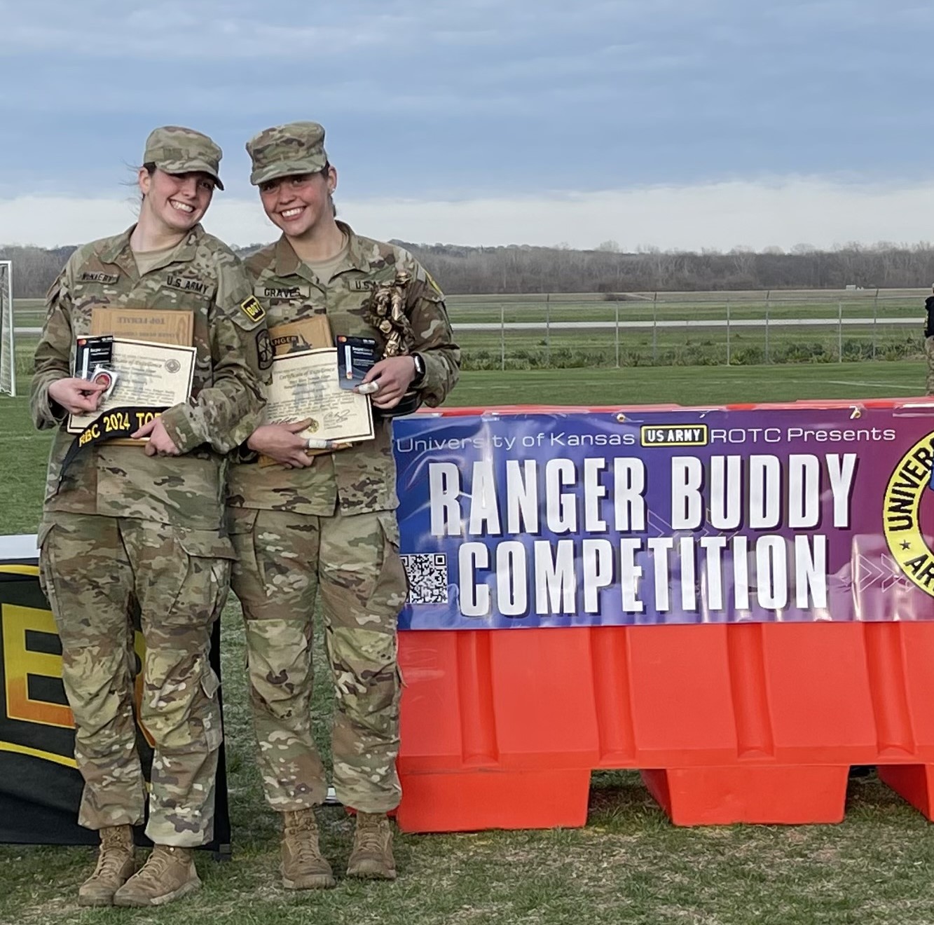 Two Cadets displaying their awards for winning first place at Ranger Buddies, spring 2024.