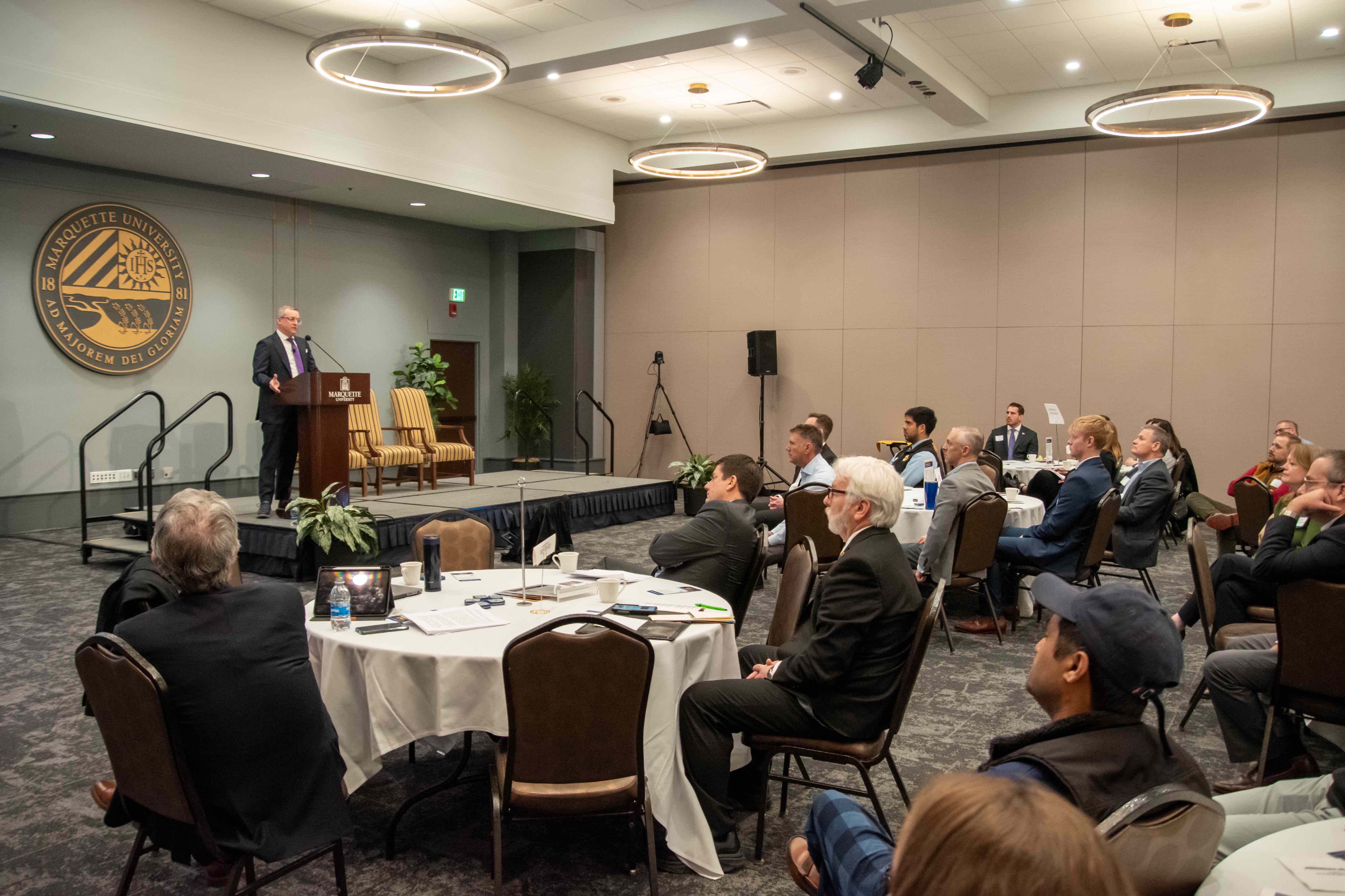 A crowd watches the keynote speaker at the 2025 Commercial Banking Conference