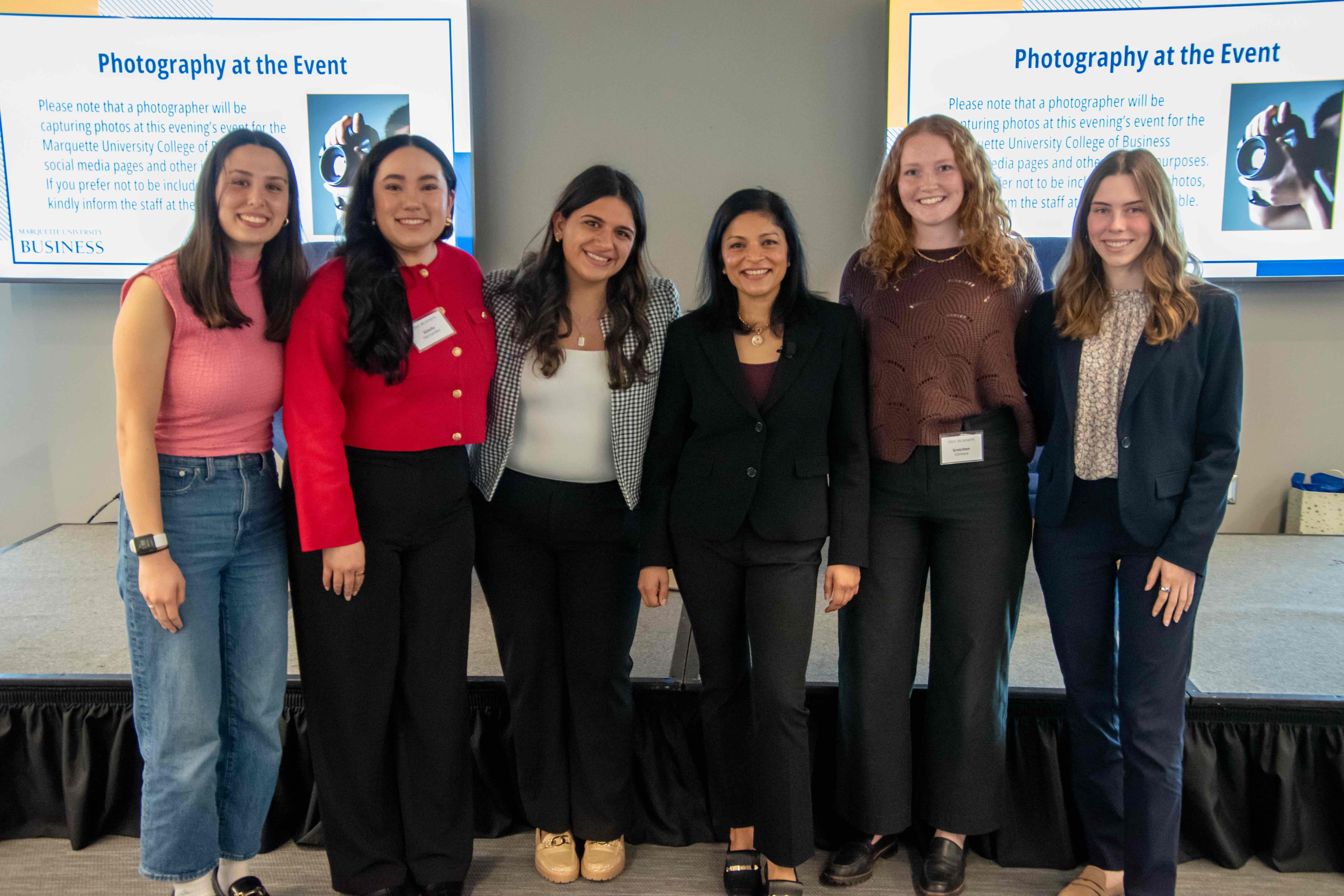 Zoom CEO Aparna Bawa poses with Marquette students at the Loebl Women in Business lecture