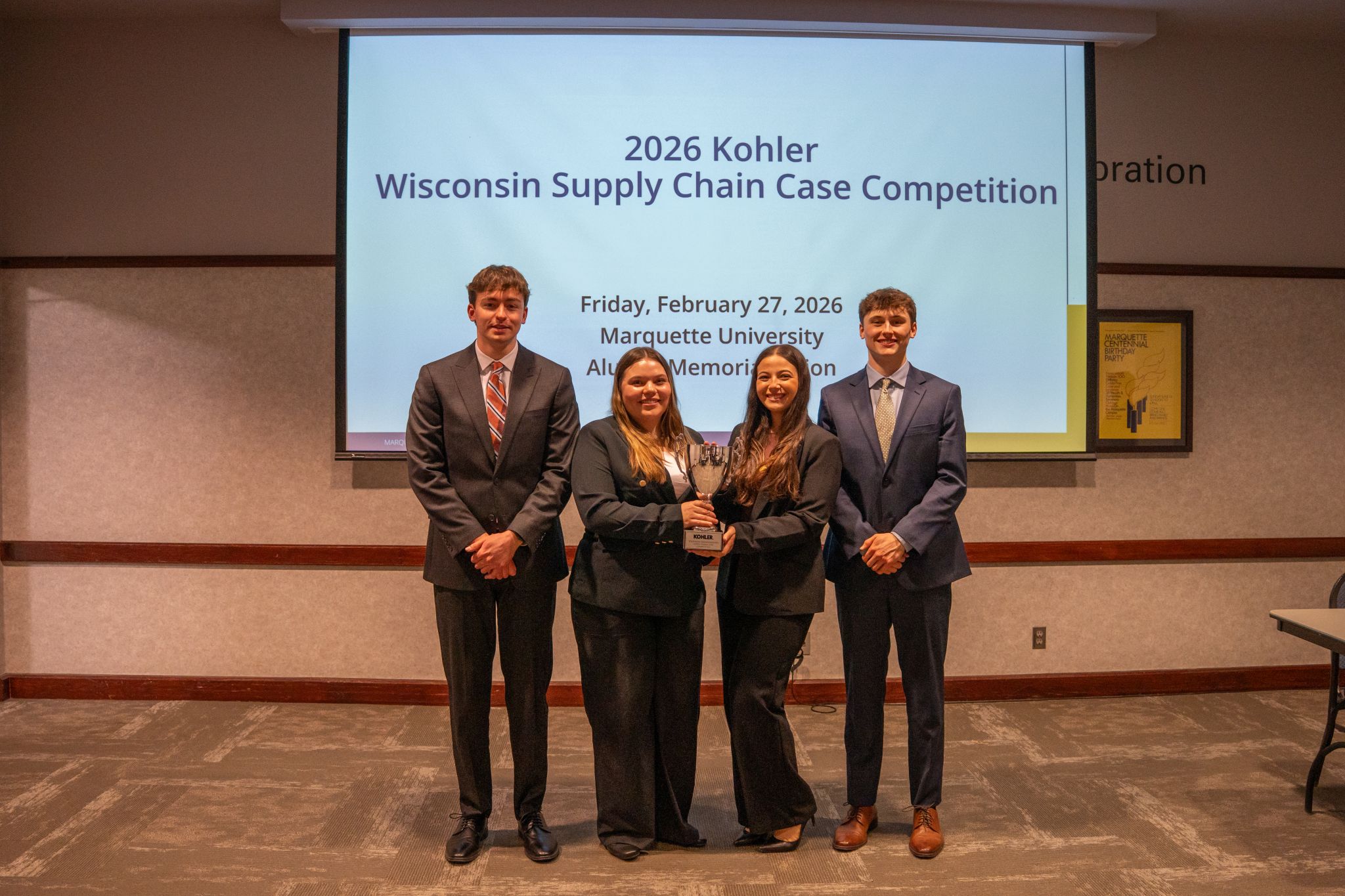 Students pose with case competition trophy