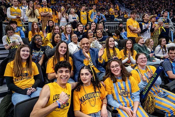 Marquette fans dressed in blue and gold