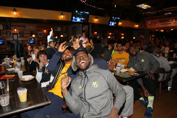 student athletes and fans watch sports at the annex