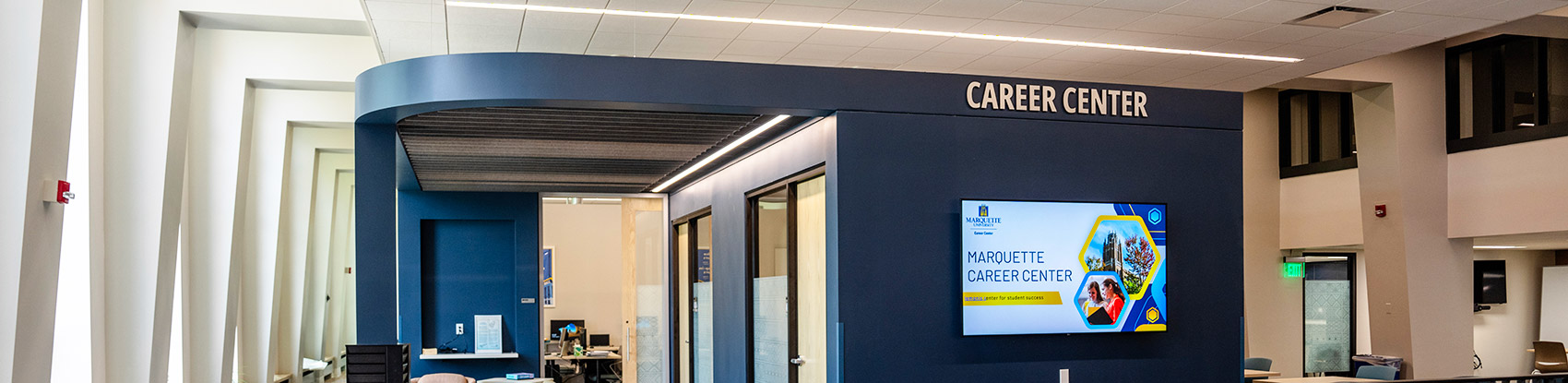 A photo of Marquette University's Lemonis Center of Student Success on the fourth floor facing the student waiting area in front of some of the Career Center's offices 