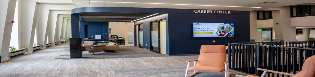 A photo of Marquette University's Lemonis Center of Student Success on the fourth floor facing the student waiting area in front of some of the Career Center's offices 