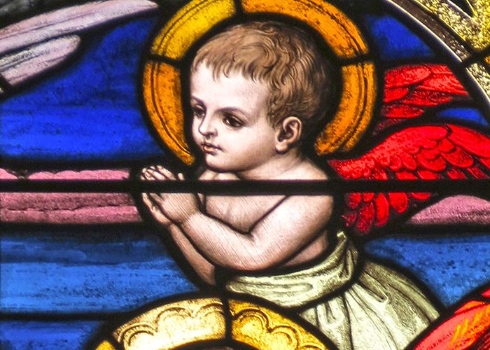 Cherub in a stained glass window at Gesu Church