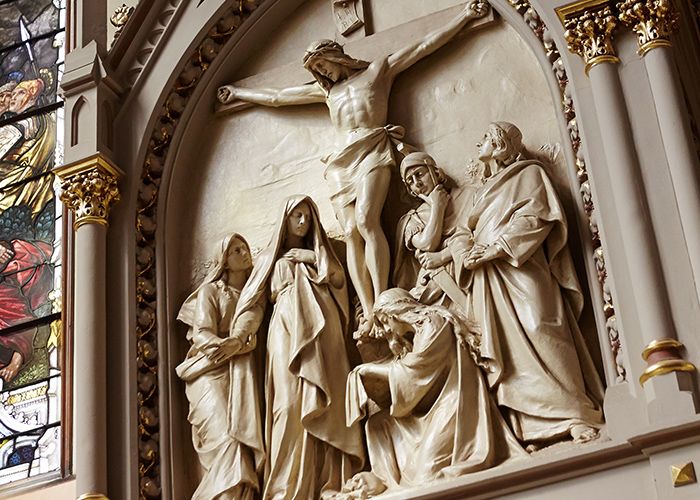 Twelve station of the Cross in Gesu Church depicting the Jesus on the cross