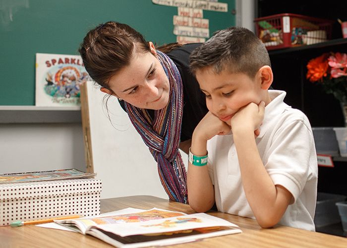 Student and teacher reading