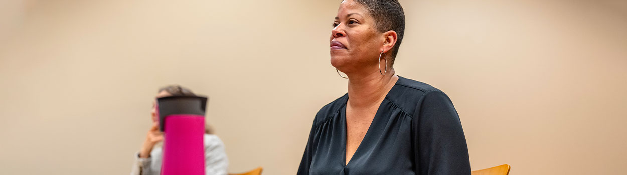 Female School District Superintendent Smiling in a Classroom