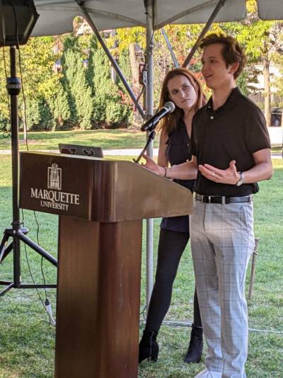 Sigma Iota Rho Vice President Kaley Gilbert and President Jack Hammerton address attendees of the annual INIA "Grow Your Global Knowledge" event.