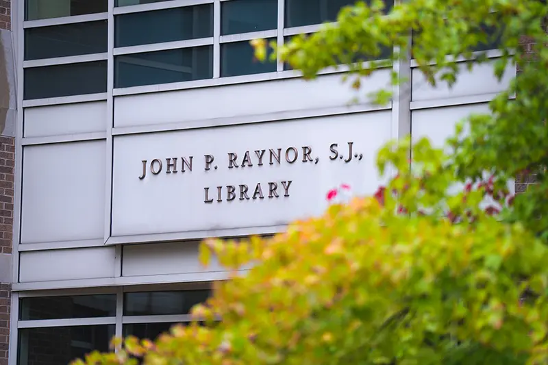 Raynor library sign on exterior of library