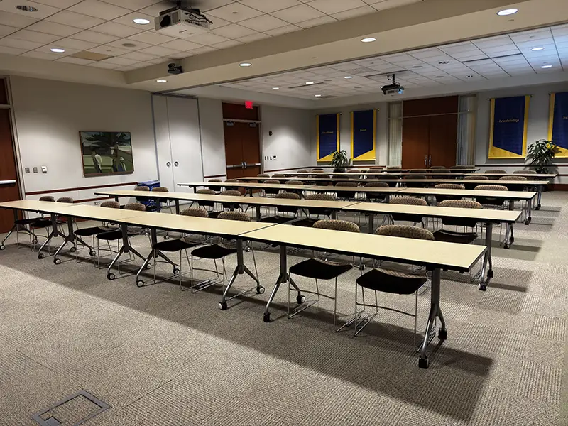 Conference center with tables and chairs in rows