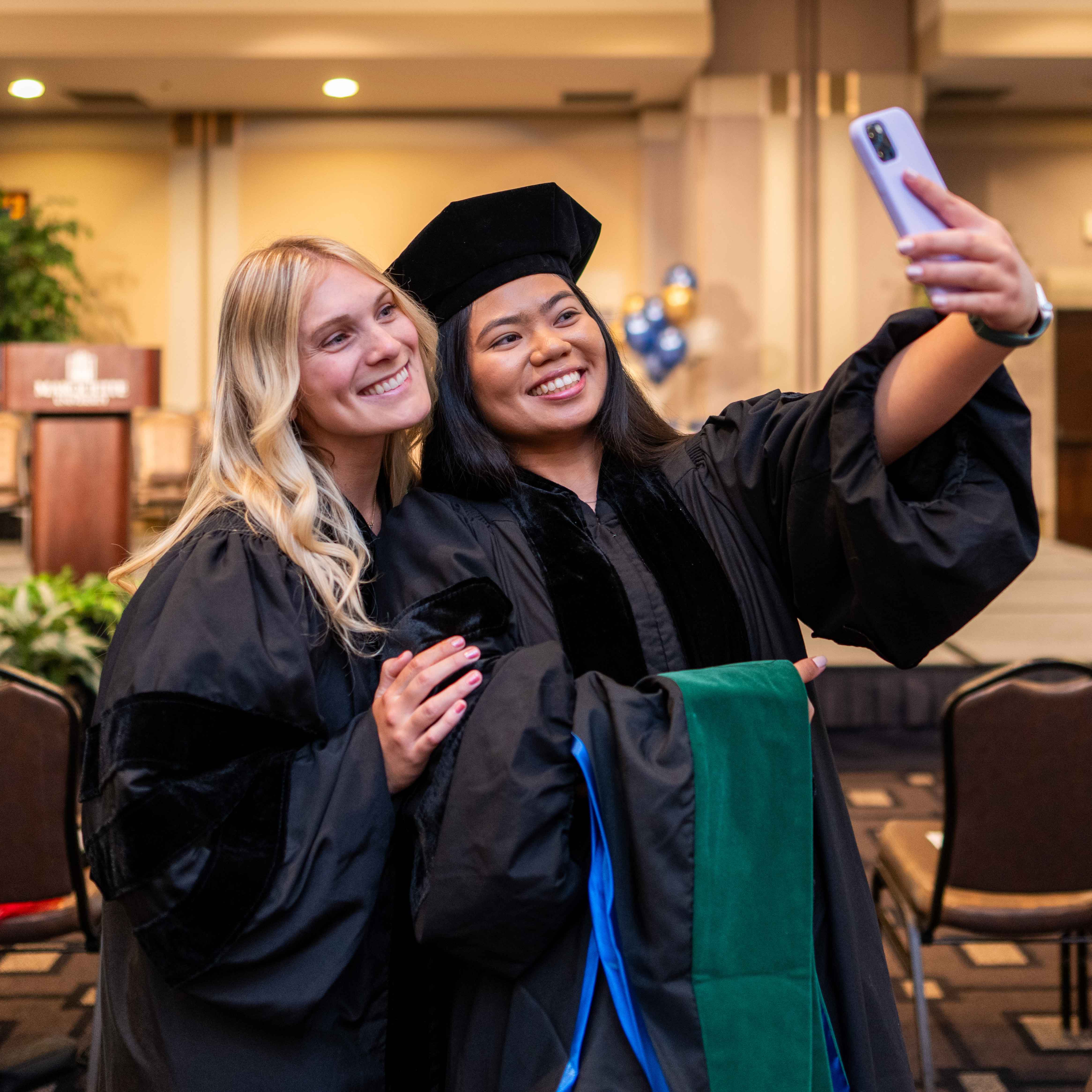 Two students at graduation 