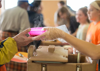 Student serving meal