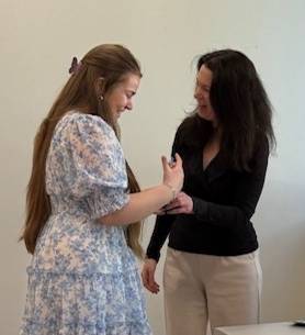 Dr. Bloch-Mullins congratulatees Bella DeRosa