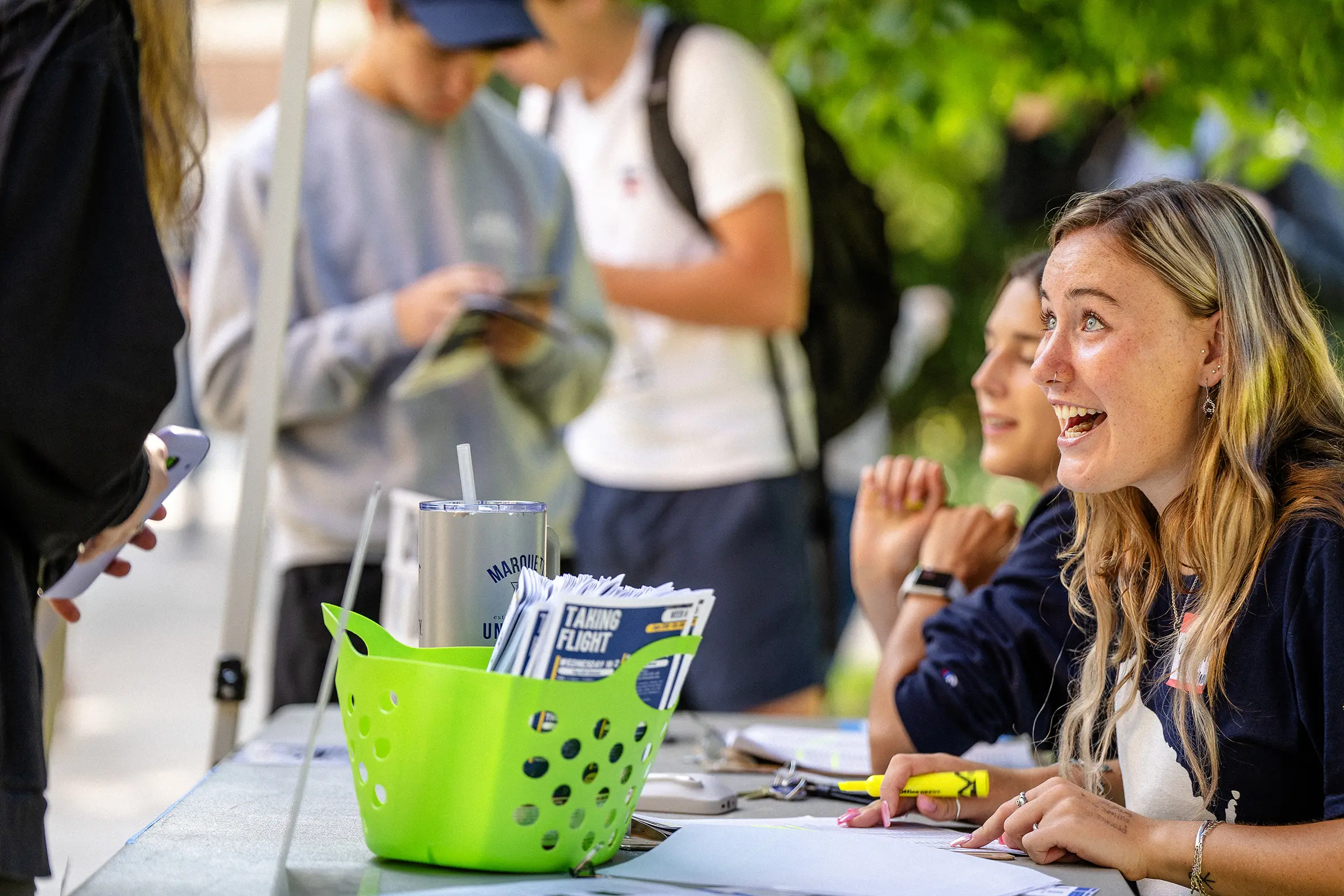 RAs siting at a table checking in new residents