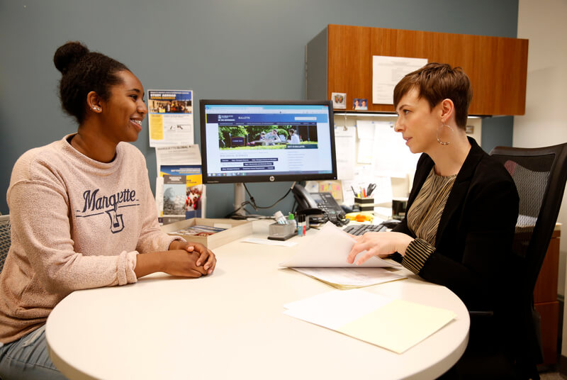 Student and teacher talking